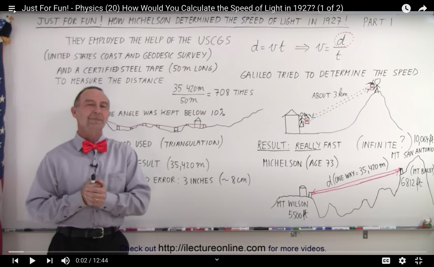 Michael Van Biezen works out the speed of light on a whiteboard
